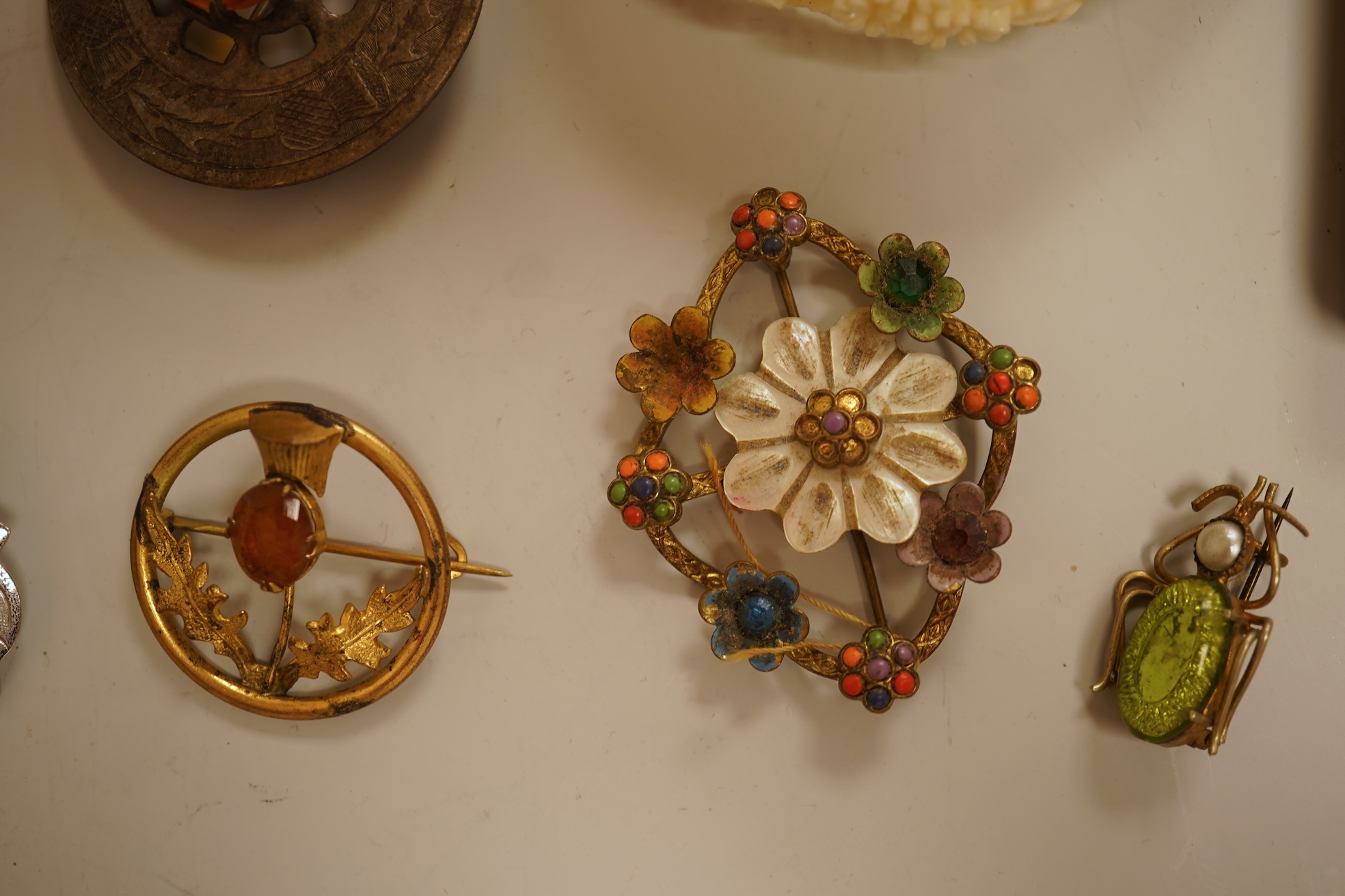 A small group of assorted jewellery including a gold plated curb link bracelet, silver brooch, simulated pearl necklace and costume.